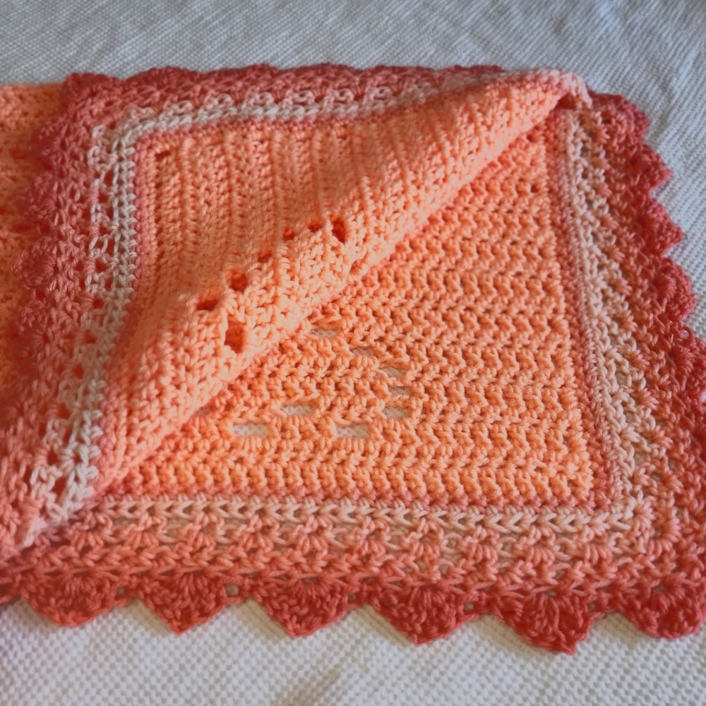 Handmade crochet peaches and cream baby love blanket